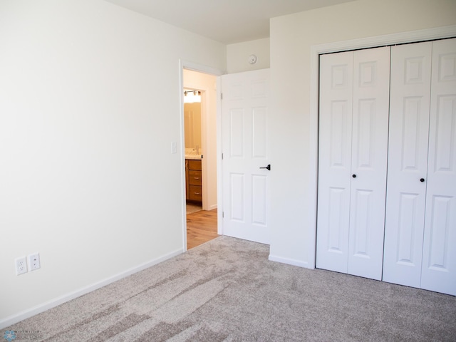 10302 Burgundy Dr, Horace, ND 58047 - unfurnished bedroom with carpet floors, a closet, and baseboards