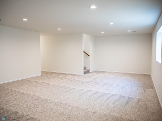 10302 Burgundy Dr, Horace, ND 58047 - empty room with recessed lighting, light colored carpet, stairway, and baseboards