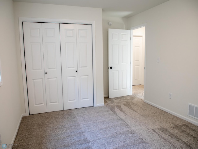 10302 Burgundy Dr, Horace, ND 58047 - unfurnished bedroom with carpet, a closet, and baseboards