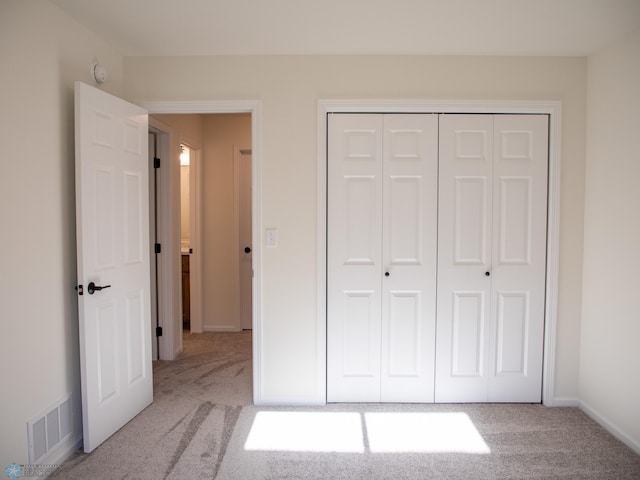 10302 Burgundy Dr, Horace, ND 58047 - unfurnished bedroom featuring carpet, a closet, and baseboards