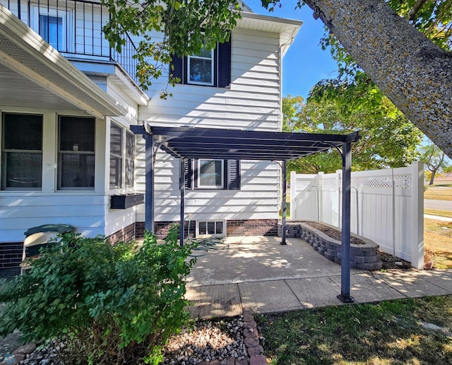view of patio with fence and a pergola