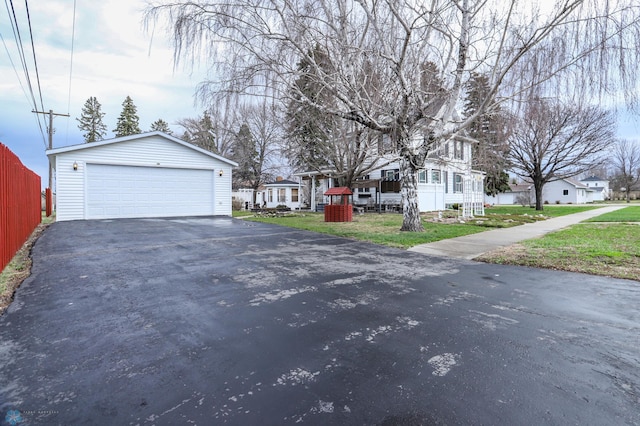 view of asphalt driveway featuring a residential view