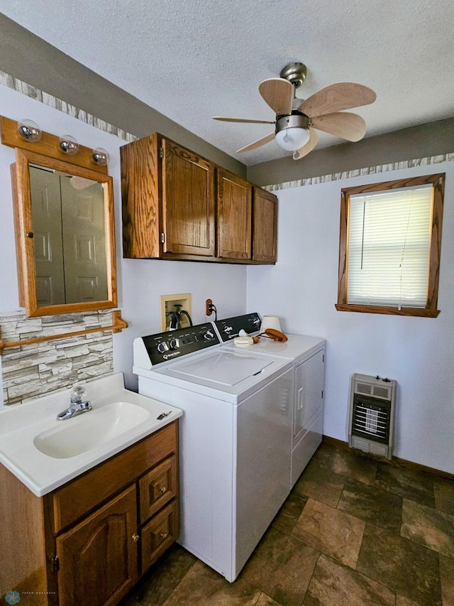 laundry room featuring independent washer and dryer, cabinet space, a ceiling fan, heating unit, and a textured ceiling