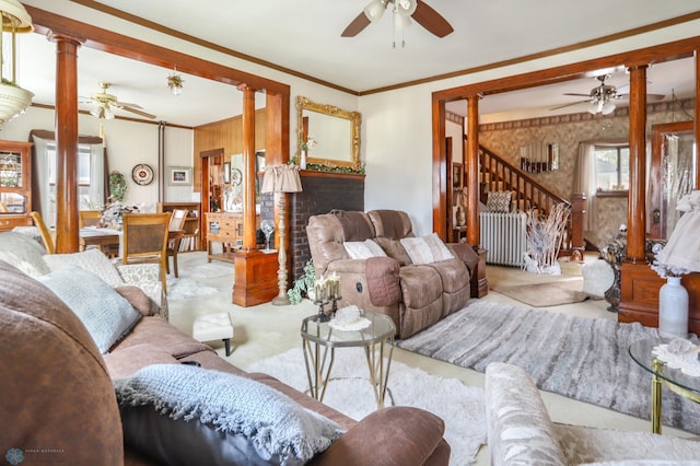 living area with a ceiling fan, ornate columns, carpet, and crown molding