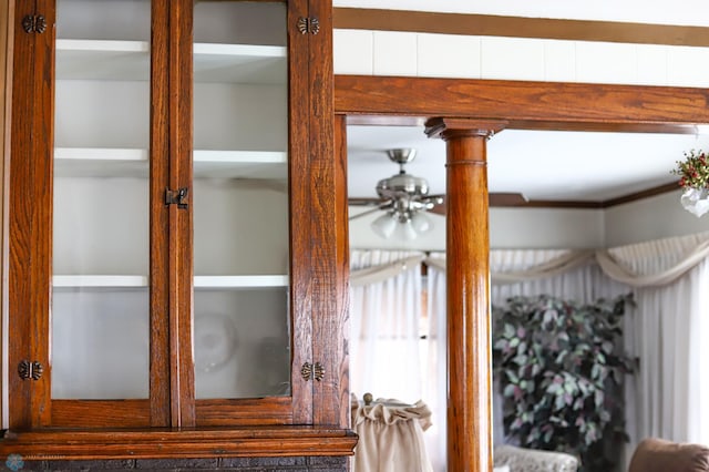 detailed view of a ceiling fan and decorative columns