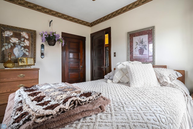 bedroom featuring crown molding