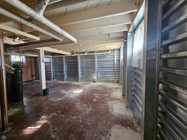 basement featuring a water softener system