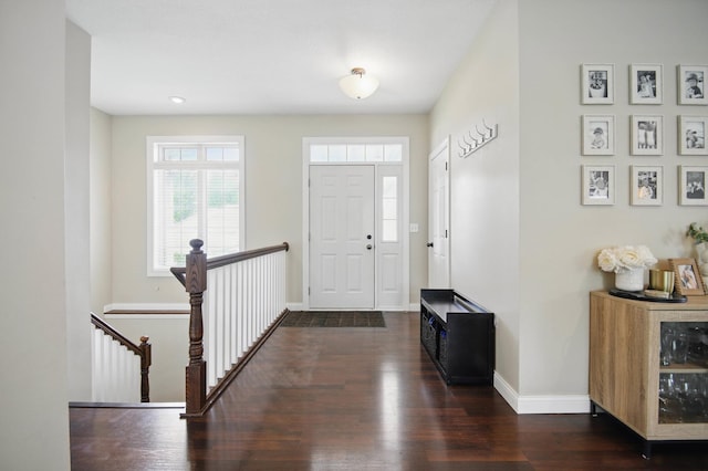 entryway featuring dark wood-style flooring, baseboards, and recessed lighting