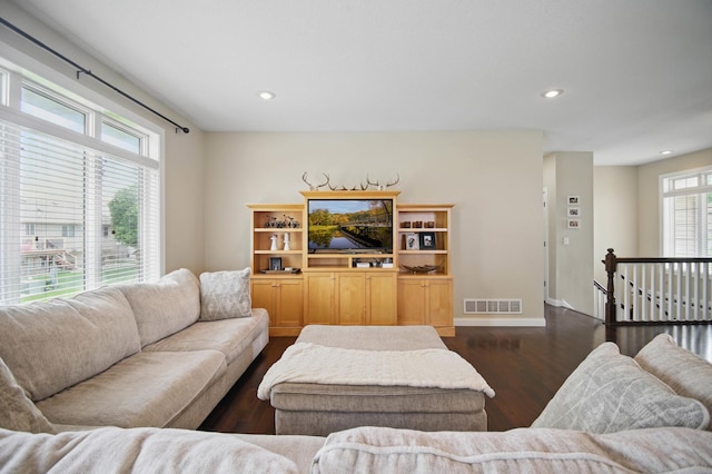 living room featuring dark wood-style flooring, recessed lighting, and baseboards