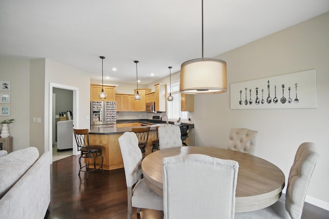 dining room featuring dark wood finished floors and recessed lighting