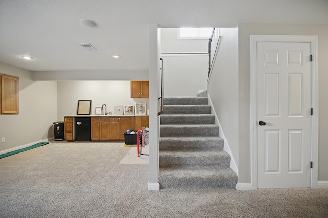 stairs with carpet, baseboards, and recessed lighting