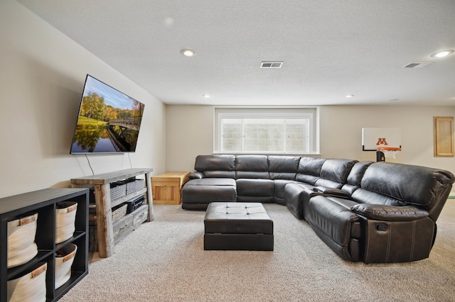 living area featuring carpet flooring, recessed lighting, and a textured ceiling