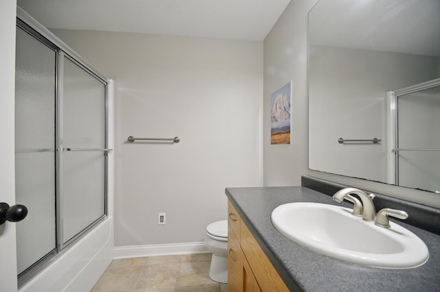 full bathroom featuring baseboards, toilet, vanity, and shower / bath combination with glass door