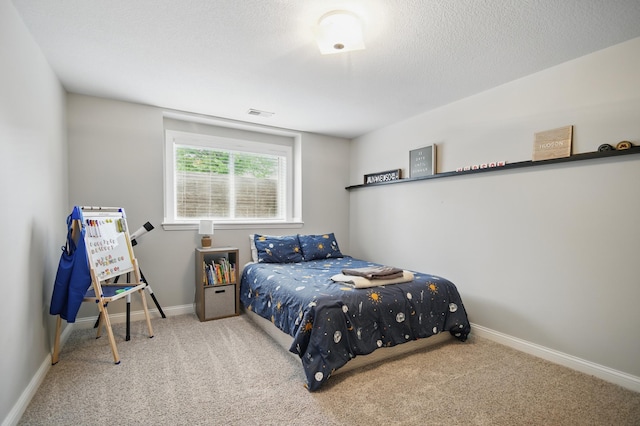 bedroom featuring carpet and baseboards