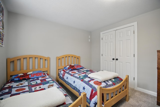 carpeted bedroom with a closet