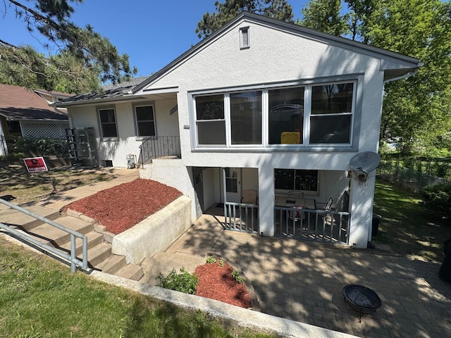 2417 S Ave E, North Saint Paul, MN 55109 - bungalow-style house featuring stucco siding and a porch
