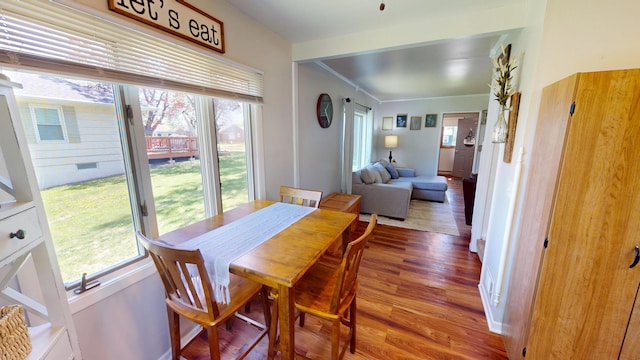 dining area with wood finished floors and healthy amount of natural light