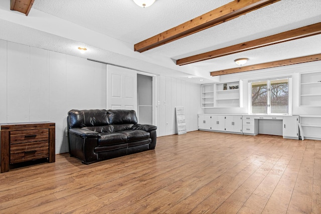 12420 Chippewa Ln, Burnsville, MN 55337 - living area with a textured ceiling, light wood-style flooring, and beamed ceiling