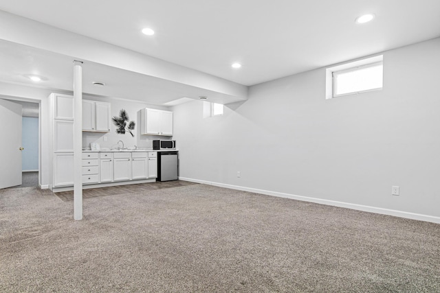 12420 Chippewa Ln, Burnsville, MN 55337 - basement with carpet floors, baseboards, recessed lighting, and a sink
