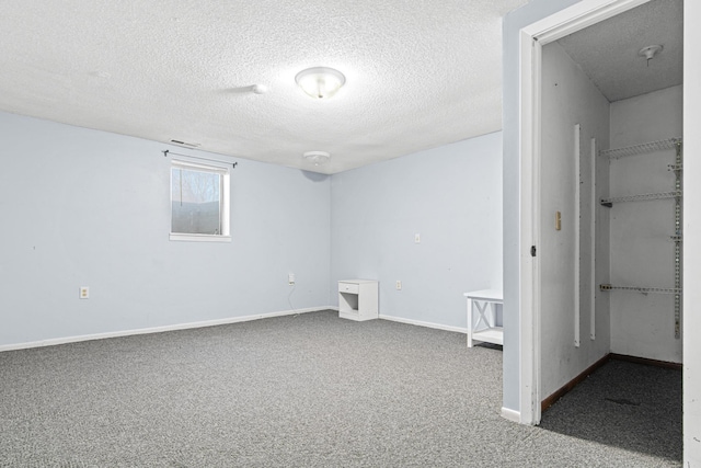 12420 Chippewa Ln, Burnsville, MN 55337 - below grade area featuring a textured ceiling, carpet floors, and baseboards