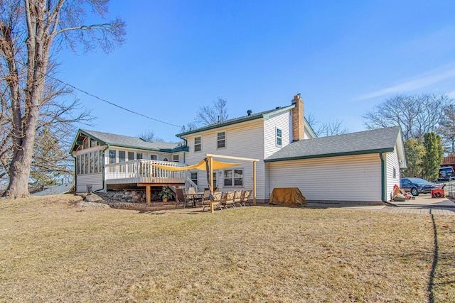12420 Chippewa Ln, Burnsville, MN 55337 - back of property with a sunroom, a chimney, a lawn, and a wooden deck