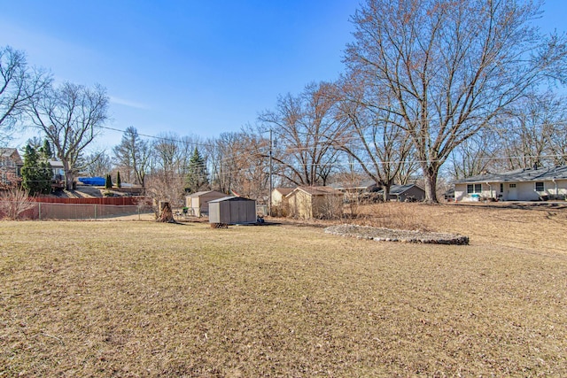 12420 Chippewa Ln, Burnsville, MN 55337 - view of yard with a storage unit and an outbuilding