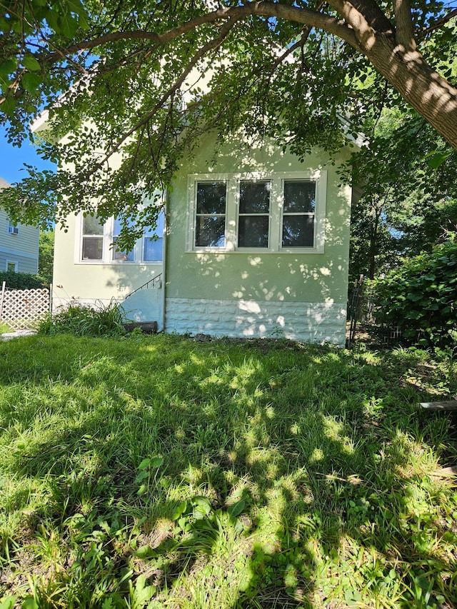 2407 4th St, Minneapolis, MN 55411 - view of side of home with stucco siding