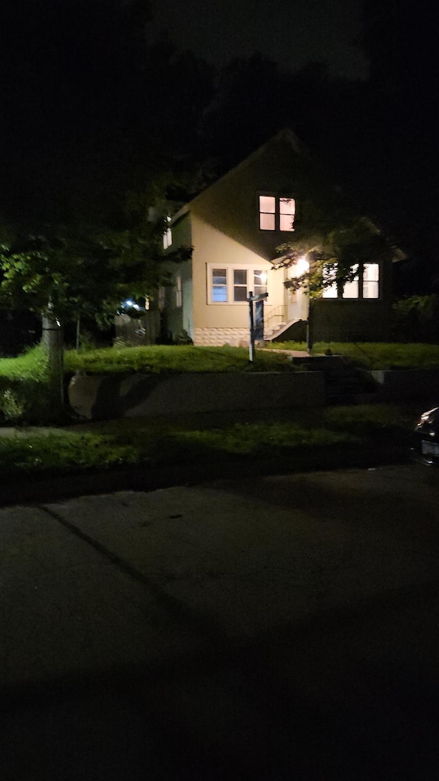 2407 4th St, Minneapolis, MN 55411 - obstructed view of property with stucco siding