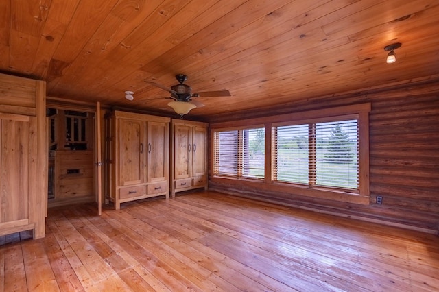 unfurnished bedroom with light wood-style floors and wooden ceiling