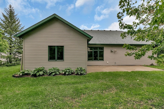 1108 Oak Pond Dr, Sartell, MN 56377 - back of property with a patio, a lawn, and roof with shingles
