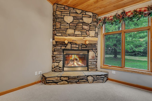 1108 Oak Pond Dr, Sartell, MN 56377 - detailed view of wooden ceiling, baseboards, carpet flooring, and a stone fireplace