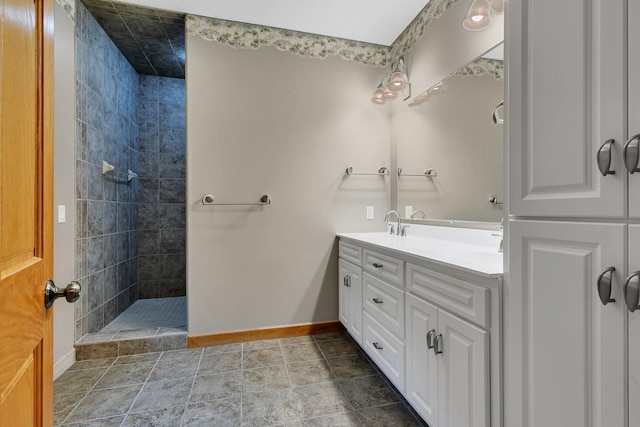 1108 Oak Pond Dr, Sartell, MN 56377 - full bath featuring baseboards, tiled shower, and double vanity