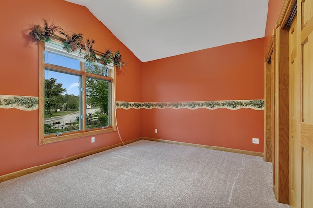 1108 Oak Pond Dr, Sartell, MN 56377 - carpeted spare room featuring vaulted ceiling and baseboards