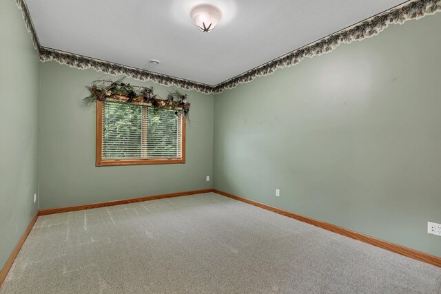 1108 Oak Pond Dr, Sartell, MN 56377 - empty room featuring light carpet and baseboards