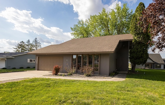 500 Lincoln St, Adams, MN 55909 - view of front facade featuring a garage, driveway, a front yard, and a shingled roof