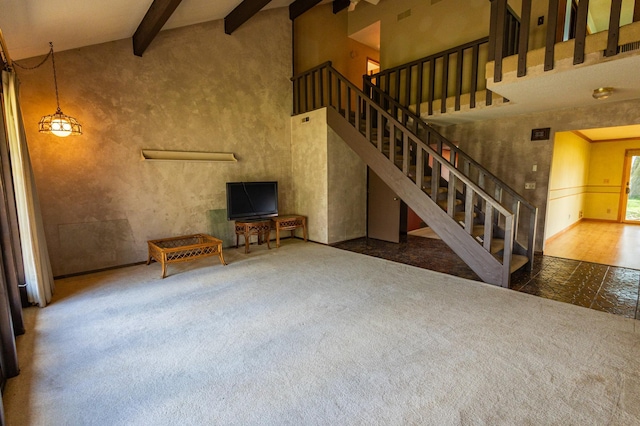 500 Lincoln St, Adams, MN 55909 - unfurnished living room with stairs, a towering ceiling, and beamed ceiling