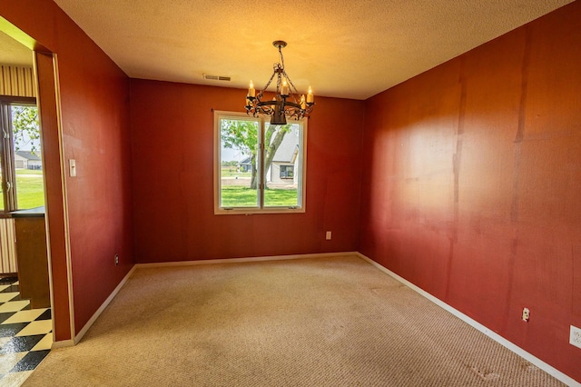 500 Lincoln St, Adams, MN 55909 - empty room featuring a chandelier, plenty of natural light, and carpet
