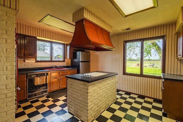 500 Lincoln St, Adams, MN 55909 - kitchen with dark flooring, freestanding refrigerator, dishwasher, custom range hood, and dark countertops