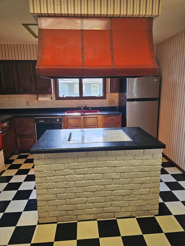 500 Lincoln St, Adams, MN 55909 - kitchen featuring light floors, a sink, black appliances, and dark countertops