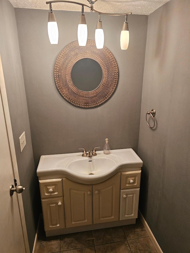 500 Lincoln St, Adams, MN 55909 - bathroom with tile patterned floors, vanity, baseboards, and a textured ceiling