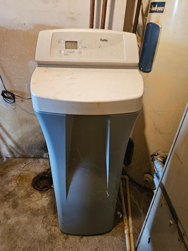 500 Lincoln St, Adams, MN 55909 - detailed view of a water softener and unfinished concrete flooring