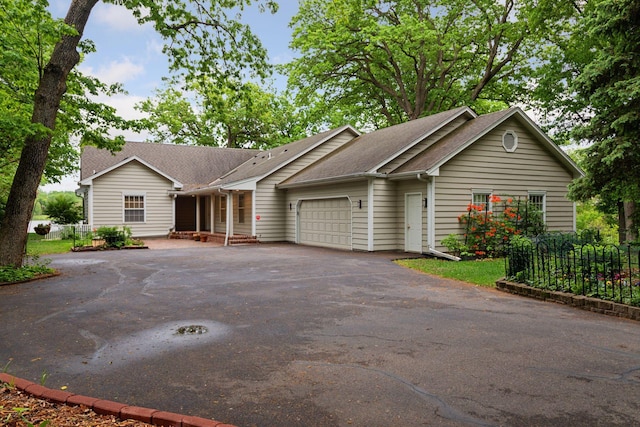 6 Shore Rd, North Oaks, MN 55127 - ranch-style home with asphalt driveway, an attached garage, and a shingled roof