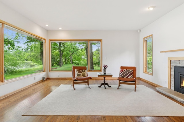 6 Shore Rd, North Oaks, MN 55127 - sitting room with healthy amount of natural light, a glass covered fireplace, baseboards, and recessed lighting