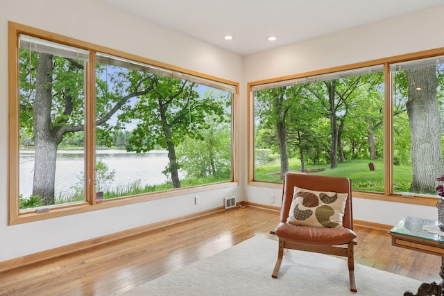 6 Shore Rd, North Oaks, MN 55127 - sunroom / solarium featuring a water view, healthy amount of natural light, and view of wooded area
