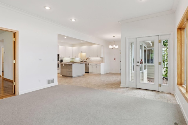 6 Shore Rd, North Oaks, MN 55127 - unfurnished living room with ornamental molding, a chandelier, light carpet, baseboards, and recessed lighting