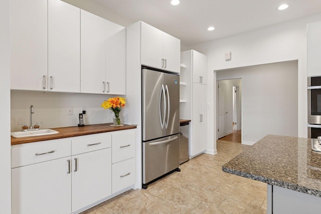 6 Shore Rd, North Oaks, MN 55127 - kitchen featuring stainless steel appliances, a sink, recessed lighting, and white cabinets