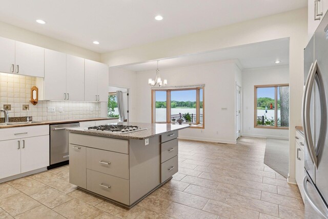 6 Shore Rd, North Oaks, MN 55127 - kitchen with appliances with stainless steel finishes, a sink, a chandelier, plenty of natural light, and recessed lighting