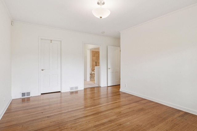 6 Shore Rd, North Oaks, MN 55127 - empty room featuring crown molding, light wood-style floors, and baseboards