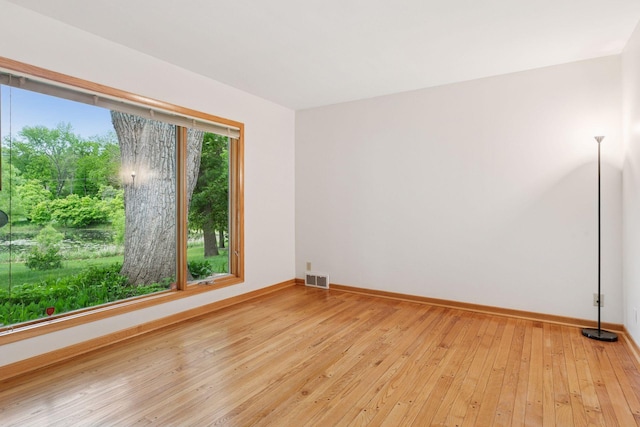 6 Shore Rd, North Oaks, MN 55127 - spare room with baseboards and light wood-type flooring