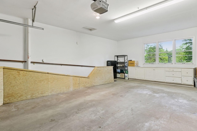 6 Shore Rd, North Oaks, MN 55127 - garage featuring a garage door opener